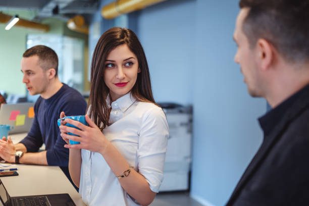 A woman is looking in a flirty way in office